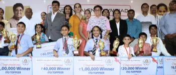 Indian Talent Olympiad (ITO) national Olympiad winners with trophies, medals, certificates, and cash prizes at a student award ceremony honoring top academic achievers across India.