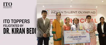 Indian Talent Olympiad toppers receiving awards from Dr. Kiran Bedi for outstanding academic achievement.